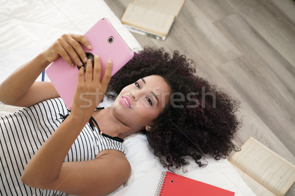 Stock photo: Hispanic Girl Using Digital Tablet For School Homework