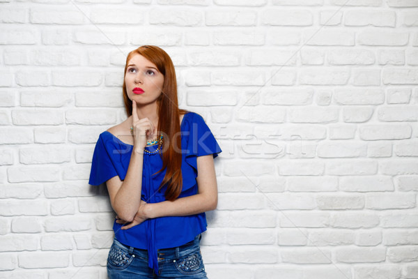 Facial Expressions Of Young Redhead Woman On Brick Wall Stock photo © diego_cervo