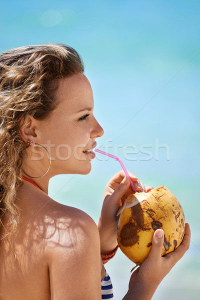 Portrait of woman relaxing with cocktail at cuban beach Stock photo © diego_cervo