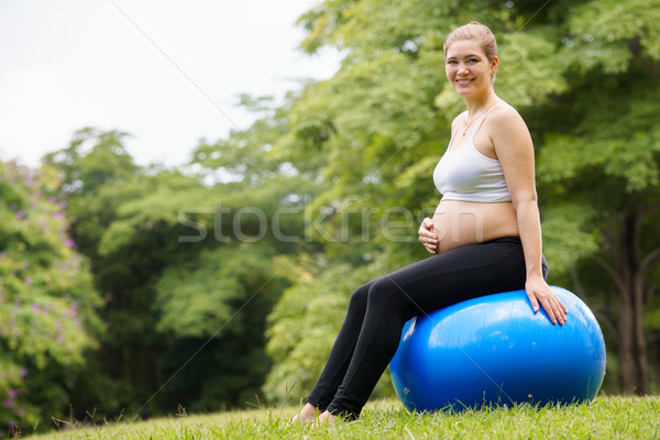 pregnant woman belly swiss fit ball workout park Stock photo © diego_cervo