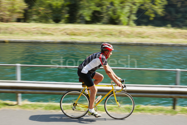 Zdjęcia stock: Starszy · rowerzysta · drogowego · rowerów · zamazany