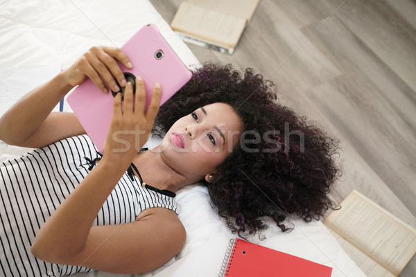 Hispanic Girl Using Digital Tablet For School Homework Stock photo © diego_cervo