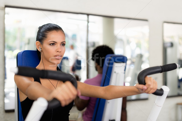 Sport people training and working out in fitness club Stock photo © diego_cervo