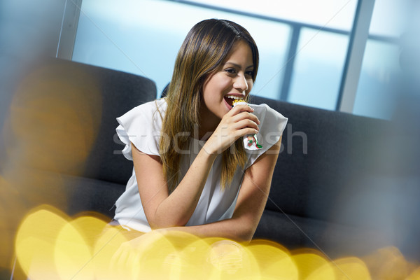 Woman Sitting At Home Eating Low Fat Cereal Bar Stock photo © diego_cervo