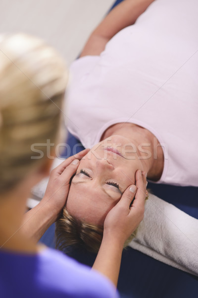 Fiatal terapeuta reiki terápia idős nő Stock fotó © diego_cervo