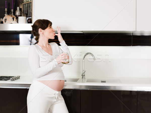 Femeie gravida mananca miere borcan portret italian Imagine de stoc © diego_cervo