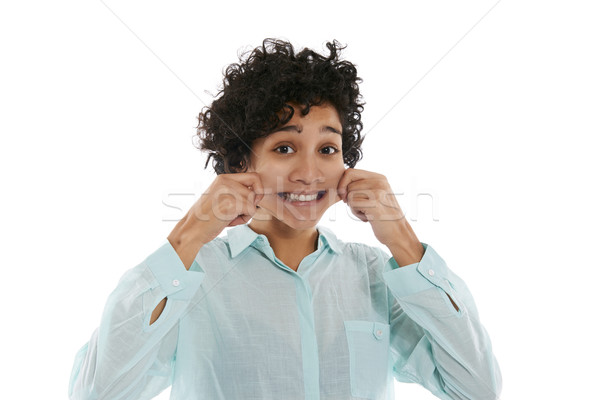 portrait of woman pinching cheeks and smiling Stock photo © diego_cervo