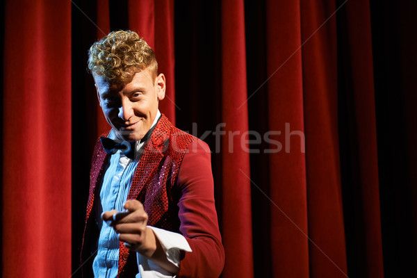 Portrait of anchorman at show against red curtain Stock photo © diego_cervo