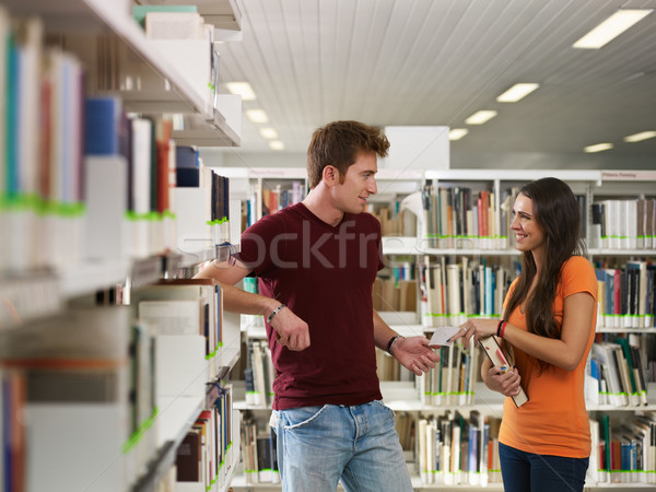 élèves flirt bibliothèque Homme téléphone [[stock_photo]] © diego_cervo