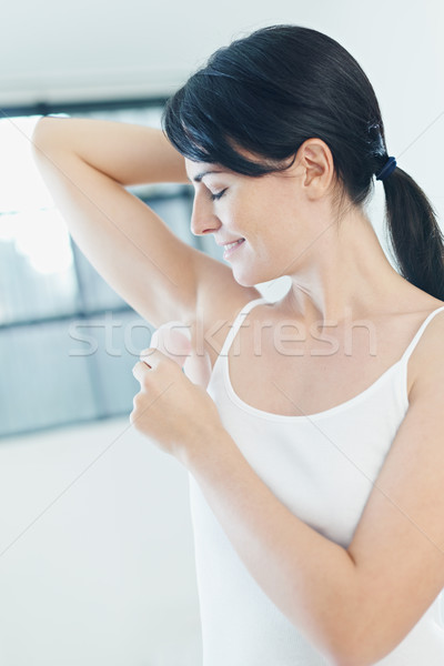 Stick deodorante donna sorridere vista laterale donne Foto d'archivio © diego_cervo