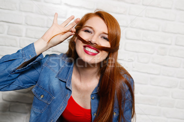 Facial Expressions Of Young Redhead Woman On Brick Wall Stock photo © diego_cervo