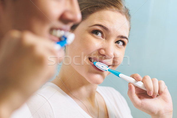 Couple Washing Teeth Man And Woman Together In Bathroom Stock photo © diego_cervo