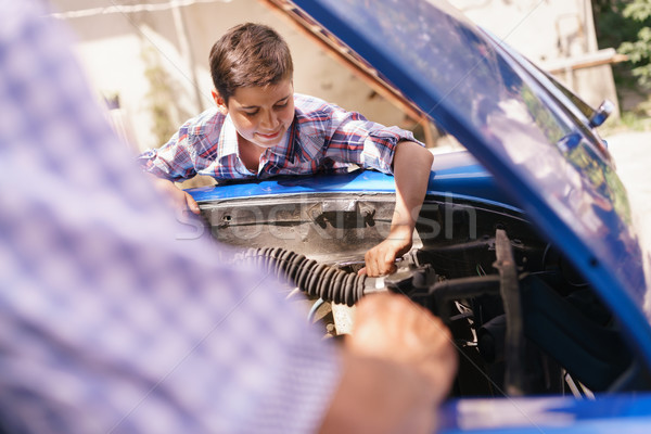Old Man Grandpa Teaching Boy Fixing Car Engine Stock photo © diego_cervo