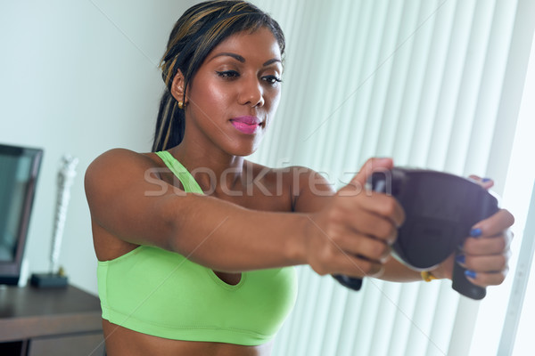 Black Athlete Woman Measures Body Fat With Electronic Equipment Stock photo © diego_cervo