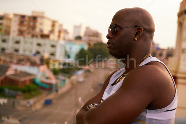 Forte uomo nero attesa guardando città nero Foto d'archivio © diego_cervo