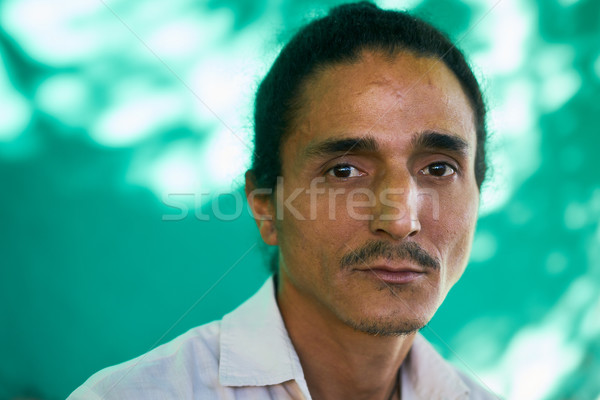 Depressed Young Latino Man With Sad Worried Face Expression Stock photo © diego_cervo