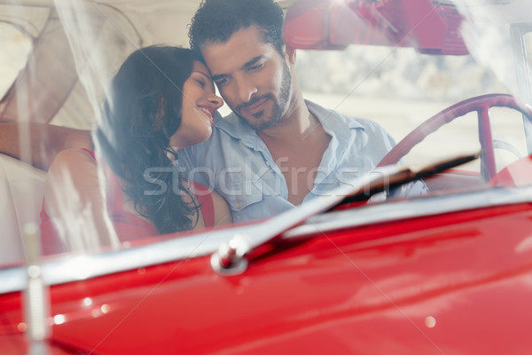 girlfriend and boyfriend flirting in red old car Stock photo © diego_cervo