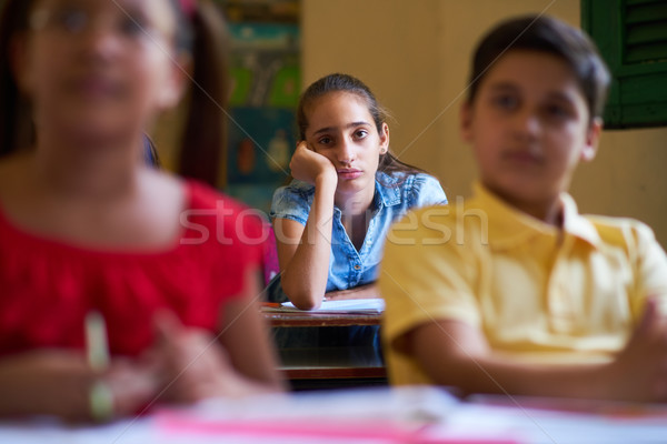 Aburrido femenino estudiante nina clase escuela Foto stock © diego_cervo