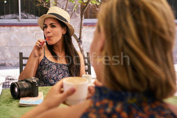 Woman Smoking Electronic Cigarette Drinking Coffee In Bar Stock photo © diego_cervo