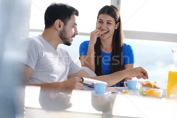 Young Couple Eating Breakfast At Home On Sunday Stock photo © diego_cervo