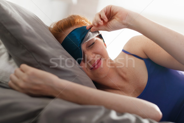Woman In Bed With Sleep Mask On Eyes Waking Up Stock photo © diego_cervo