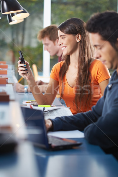 group of three people in library Stock photo © diego_cervo