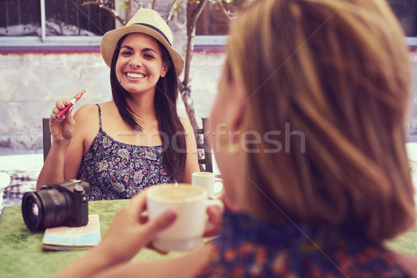 Happy Woman Smoking Electronic Cigarette Drinking Coffee In Bar Stock photo © diego_cervo