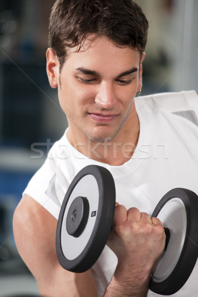 Sală de gimnastică portret tânăr frumos antrenament Imagine de stoc © diego_cervo