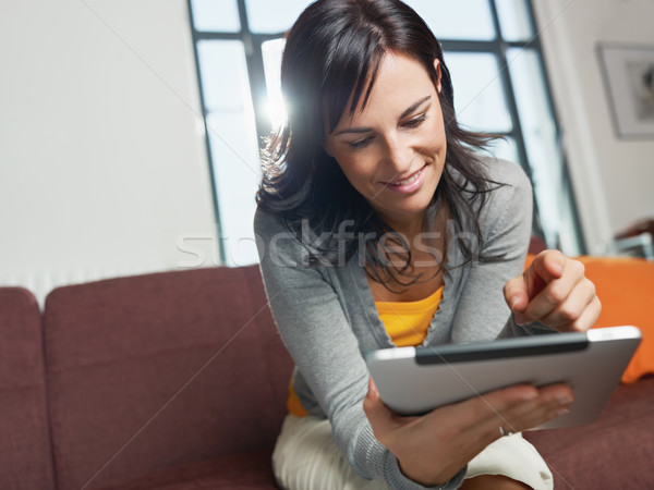 Femme adulte séance canapé horizontal [[stock_photo]] © diego_cervo