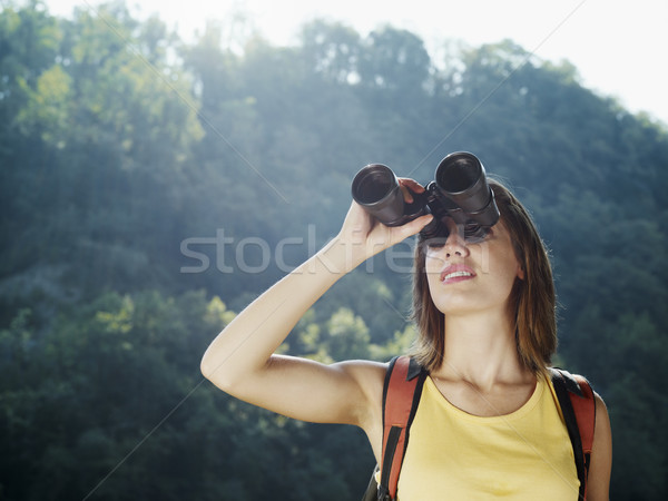 young woman hiking with binoculars  Stock photo © diego_cervo