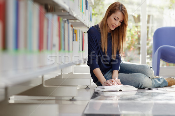 girl studying on floor in library Stock photo © diego_cervo