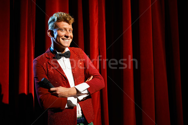 Portrait of anchorman at show against red curtain Stock photo © diego_cervo