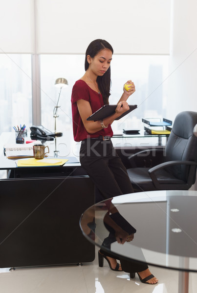 Nervous business woman with anti stress ball holds tablet Stock photo © diego_cervo