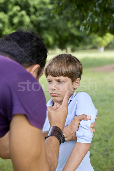 Parenthood and children education, angry man scolding boy in par Stock photo © diego_cervo