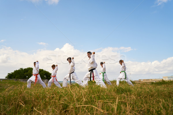 Karate School With Teacher And Boys Warming Up Stock photo © diego_cervo