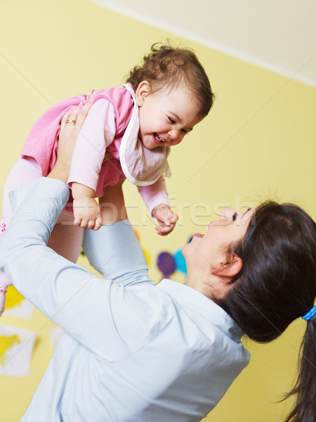 mother playing with her baby Stock photo © diego_cervo