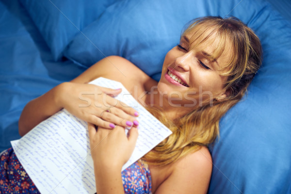 Girl In Bed Reading Love Letter From Boyfriend Stock photo © diego_cervo