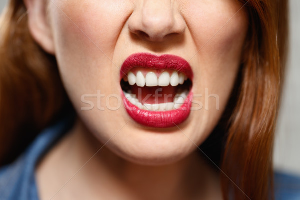 Expressões faciais jovem mulher parede de tijolos Foto stock © diego_cervo