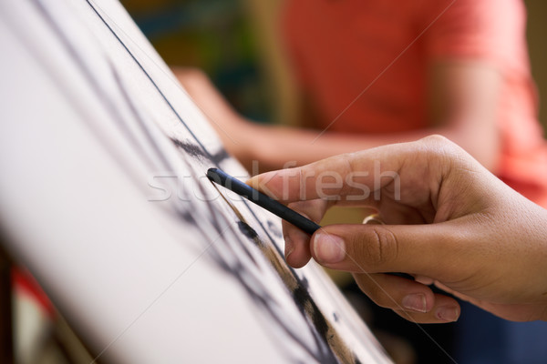 Male Hand Drawing Young Man Sketching Artist Training At School Stock photo © diego_cervo