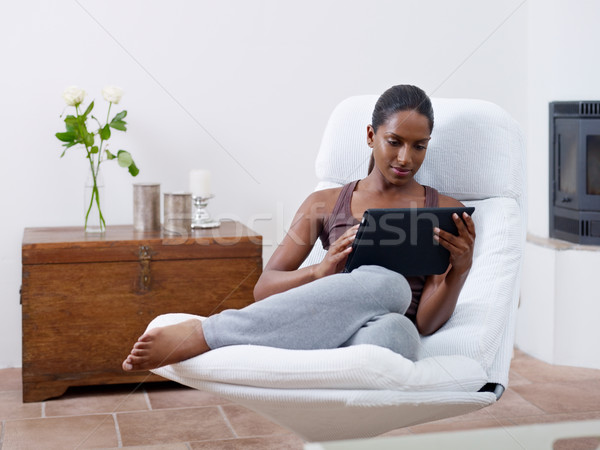 woman using tablet pc at home Stock photo © diego_cervo