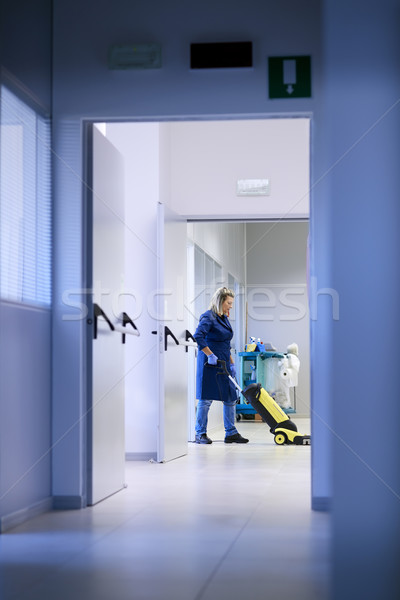 Women at workplace, professional female cleaner washing floor in Stock photo © diego_cervo