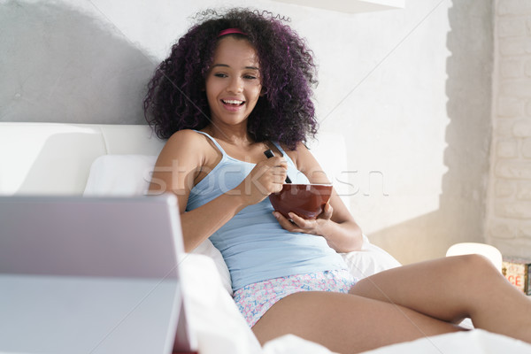 Young People Eating Breakfast Watching Film In Bed Stock photo © diego_cervo