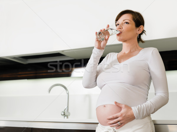 孕婦 飲用水 肖像 意大利的 個月 廚房 商業照片 © diego_cervo