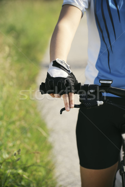 young woman training on mountain bike and cycling in park Stock photo © diego_cervo