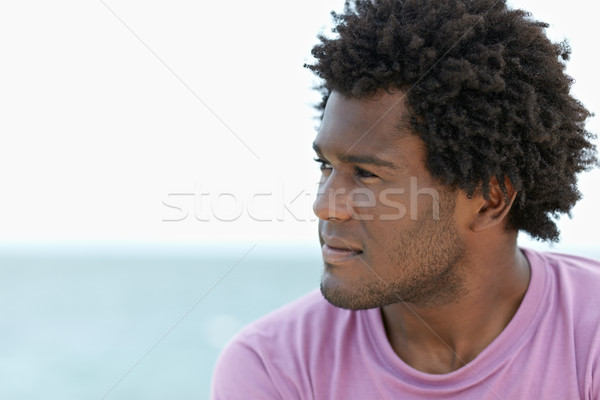 Stock photo: young african man on the beach