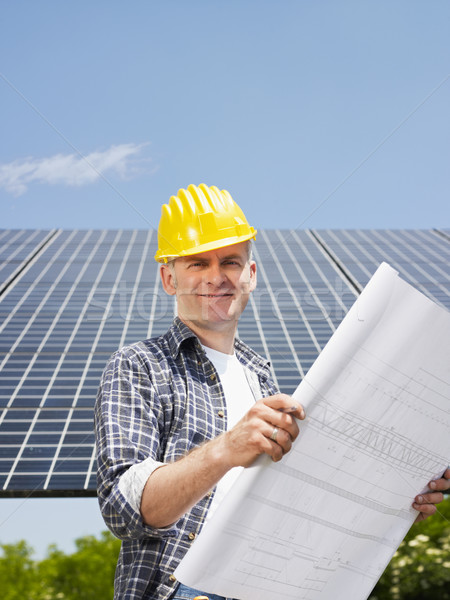 electrician standing near solar panels Stock photo © diego_cervo