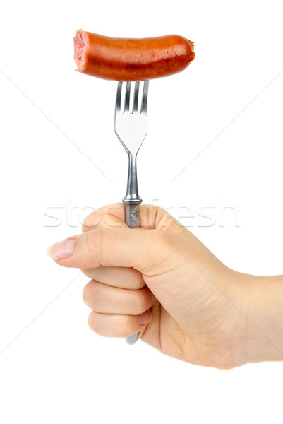 Hand holding half eaten sausage on fork. Stock photo © digitalr