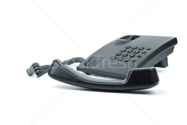 Black office phone with handset in foreground Stock photo © digitalr