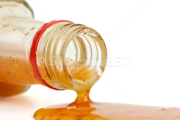 Piquant red sauce leaking from the bottle Stock photo © digitalr