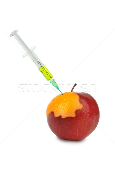 GMO: apple being mutated into the orange after injection of unknown green liquid Stock photo © digitalr